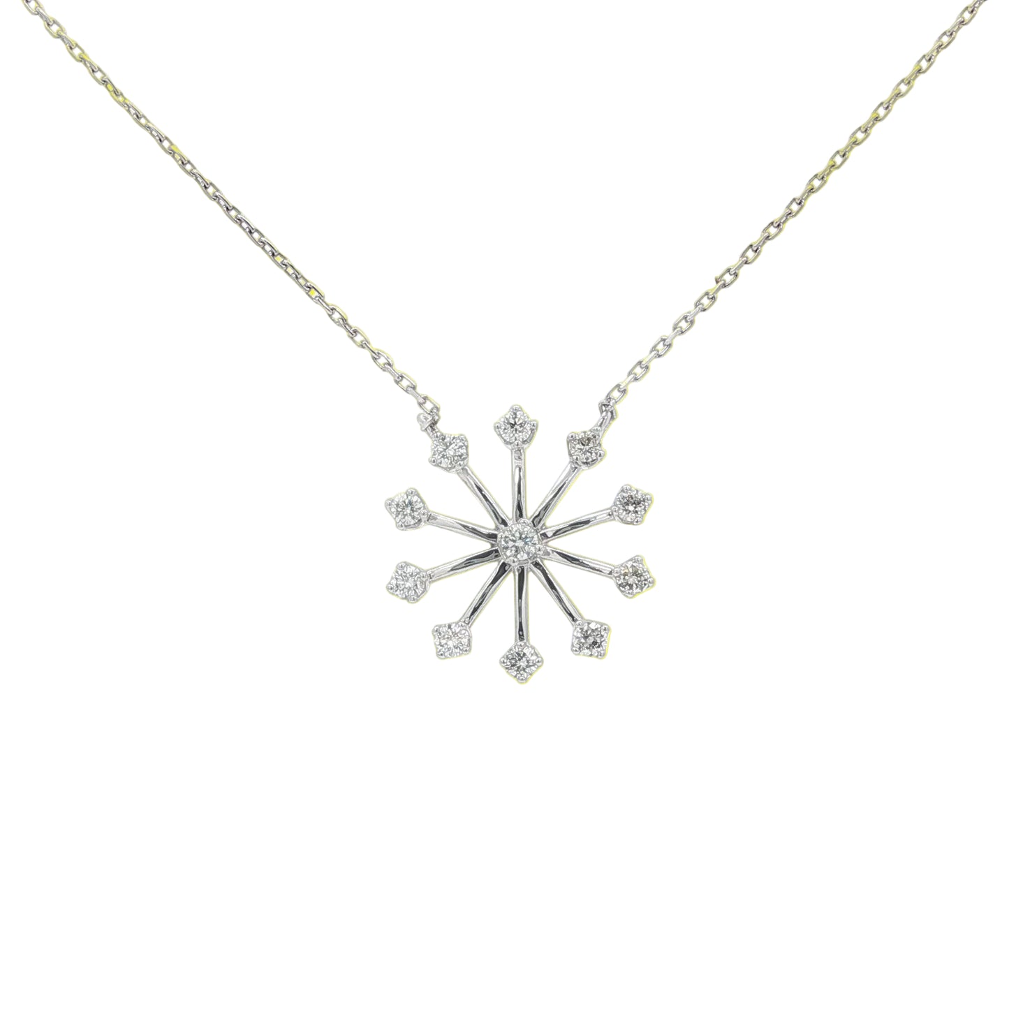 Snowflake-shaped diamond necklace on a white background
