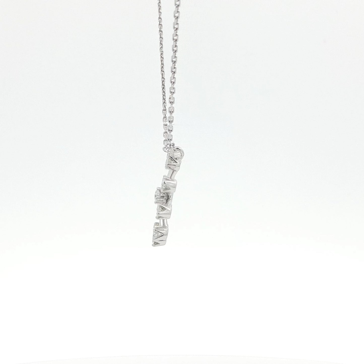Silver necklace with a unique pendant on a white background