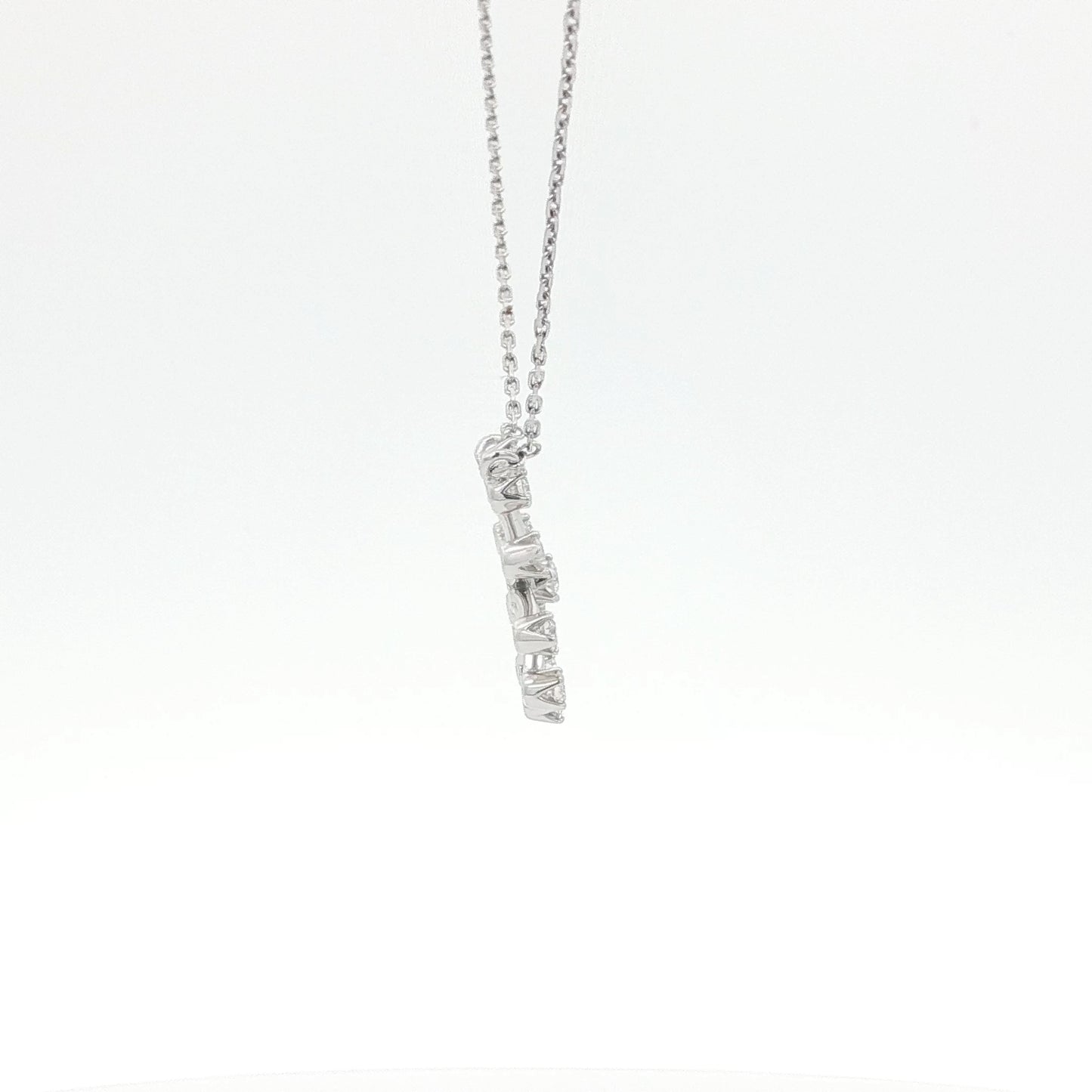 Silver necklace with a pendant on a white background
